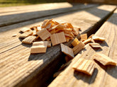 Western BBQ Products Apple Smoking Wood Chips lifestyle photo — close-up beauty shot of raw apple wood chips