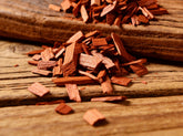 Western BBQ Products Cherry Smoking Wood Chips lifestyle photo — close-up beauty shot of raw cherry wood chips