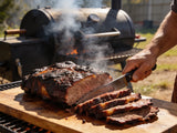 Western BBQ Products Mesquite Smoking Wood Chips lifestyle photo — beef brisket sliced beside the smoker with mesquite smoke rising