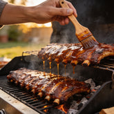 Smoke on Wheels Bootleg Bourbon BBQ Sauce – basting ribs on the grill