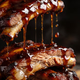 Republic Smokey BBQ Sauce gluten-free - macro close-up of sauce dripping off a sticky pork rib