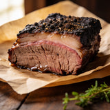 Outlaw Barbecue Stockman CRUST 250g espresso beef rub — close-up of brisket with a near-black bark and juicy grain