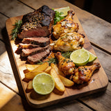 Outlaw Barbecue four pack BBQ rub bundle — shared platter of brisket, garlic-butter chicken, lime wings and potatoes