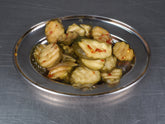 ACIDE Hot, Sour and Slightly Sweet Cucumber Chips crinkle-cut pickles served on a burger