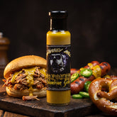 Capones Columbian Gold jalapeno mustard sauce styled with a pulled pork roll