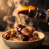 The Buffalos Bluff sauce poured over a bowl of Korean sesame wings