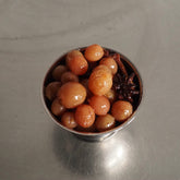 ACIDE Mulled Wine Pickled Grapes served with cheese on a board