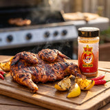 Atomic Chicken Peri Peri rub — butterflied flame-grilled peri peri chicken on a board with lemon and chilli
