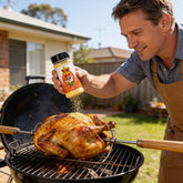 Atomic Chicken Chicken Salt Seasoning 330g — home cook seasoning a spit-roasted whole chicken on the barbecue
