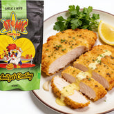 Atomic Chicken Chicken Schnitzel Herb & Garlic Coating 450g — crumbed schnitzel sliced open, drizzled with garlic butter sauce, lemon and parsley