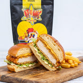 Atomic Chicken Schnitzel Original Coating — crunchy chicken schnitty burger in a brioche bun with chips