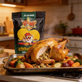 Atomic Chicken Chicken Stuffing 500g — whole roast chicken with herbed stuffing spilling from the cavity, roast veg on the tray
