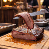 Barbecue Mafia OG Steakout BBQ Rub 2kg — carving a moist slice of smoked brisket with a pink smoke ring
