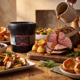 Barbecue Mafia Wagyu Tallow Gravy Mix 2kg — a roast beef carvery with a jug of glossy brown gravy