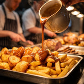 Barbecue Mafia Wagyu Tallow Gravy Mix 2kg — rich brown gravy poured over golden chips at a carvery