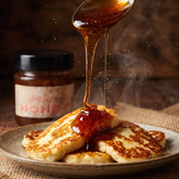 Blend Smoked Honey 250g — smoked honey drizzling over golden pan-fried halloumi