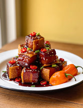 Sticky pork belly bites glazed with Booma's BBQ Boomenero spicy habanero BBQ sauce