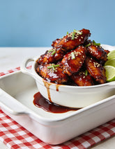 Sticky chicken wings glazed with Booma's BBQ Boomtang BBQ sauce, sesame and spring onion