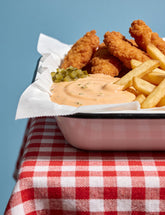 Chicken tenders and fries with Booma's BBQ Burger Sauce for dipping