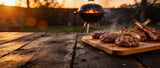 Butcher BBQ Grilling Addiction seasoned chargrilled burgers and pork chops on a backyard barbecue at dusk