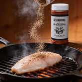 Cattleman's Grill Blackening Seasoning 281g steak rub — action shot seasoning fish on the grill