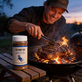 Cattleman's Grill Original Cowboy Coffee Steak Rub 283g — in-use shot searing a coffee-crusted ribeye
