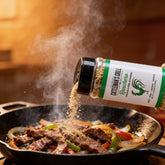 Cattleman's Grill Ranchero Seasoning 283g — action shot seasoning sizzling fajita strips