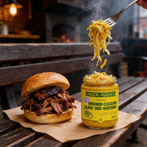 Chuck Hughes Mild Mustard Coleslaw 375ml mustard slaw relish — forkful of mustard coleslaw lifted from an open jar beside a smoked pulled pork roll