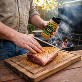 Coast n Smoke Bahia Barrels rub — cook rubbing the Brazilian spice into a raw picanha fat cap