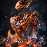 Coast n Smoke Drop-In Jerk rub — jerk chicken caught mid-flip over glowing coals with a flame flare