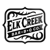 Elk Creek Bar-B-Q Co. brand logo, ornate black crest with flourishes, white glow on transparent background