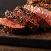 Pepper-crusted ribeye seasoned with Ember Republic Lion Night Ember Reserve