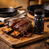 Four Saucemen The Black Rub - beef short ribs with a dark spicy bark on a board