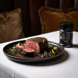 Four Saucemen The Black Truffle Rub - truffle-crusted eye fillet steak on a fine dining plate
