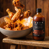 Four Saucemen Buffalo Wing Sauce - crispy wings tossed in glossy buffalo sauce