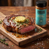 Hardcore Carnivore Cowboy Butter Mix — seared steak topped with melting compound butter beside the pack