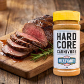 Hardcore Carnivore MeatyMite All-Purpose Rub — sliced roast beef with a savoury crust beside the pack