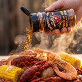 Pinch Dat Tail Cajun rub shaken over a Louisiana seafood boil