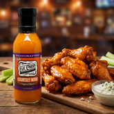 Elk Creek Country Wing sauce — glossy sauced chicken wings tossed in tangy wing sauce with celery