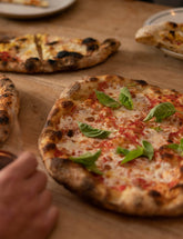 The Joy of Pizza by Dan Richer & Katie Parla hardback cookbook — margherita pizzas with fresh basil