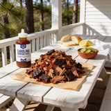 Lillie's Q Carolina Barbeque Sauce 380ml vinegar BBQ sauce — pulled pork with bark on butcher paper on a Carolina porch