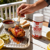 Brushing Nashville hot oil made with Lillie's Q Hot Chicken Seasoning onto fried chicken