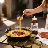 Lillie's Q Hot Smoky Barbeque Sauce 380ml spicy BBQ sauce — spoonful of mac and cheese lifted from a skillet with hot smoky sauce