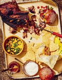 Live Fire by Helen Graves hardback cookbook — slow-cooked shoulder of pork with peach salsa
