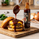Low n Slow Basics Hook Shot BBQ sauce — an open cheeseburger with the BBQ sauce spooned onto the beef patty
