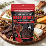 Low n Slow Basics Steak Shooter beef jerky — a grazing board with beef jerky, cheese and crackers