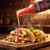 Pink Flameingo pink hot sauce drizzled over tropical fish tacos