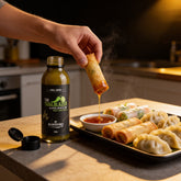 McAdventures The Trailblazer Sweet Chilli Sauce 150ml being used to dip a crispy spring roll, in-use lifestyle