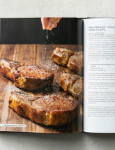 Meat Illustrated by America's Test Kitchen hardback cookbook — Pan-Seared Thick-Cut Pork Chops spread