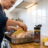 Middle Kingdom Chicken Chieftain 160g chicken seasoning — home cook rubbing the seasoning under the skin of a whole raw chicken